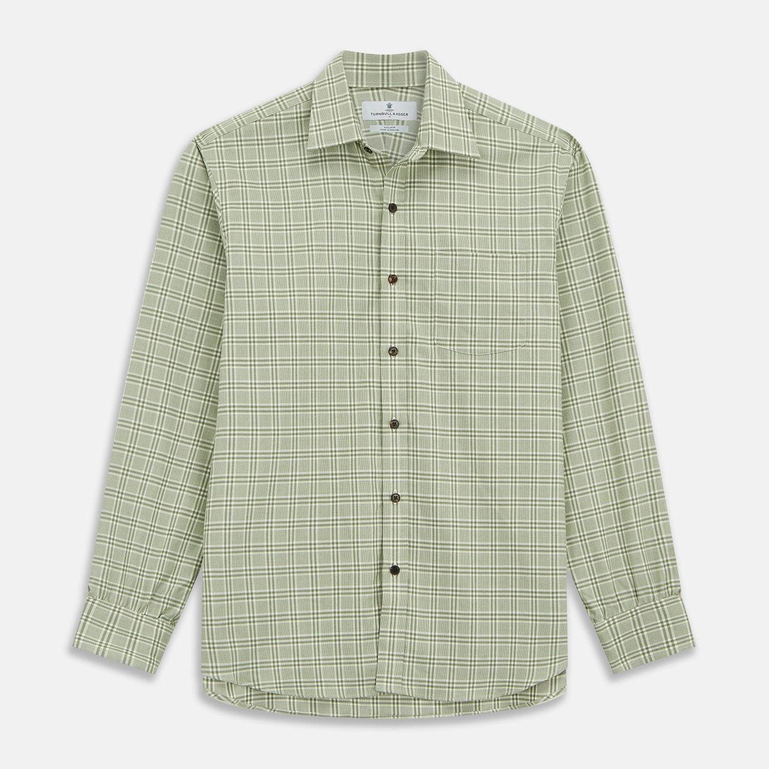 View 2 of product Close-up of Turnbull & Asser's Green Check Cotton Fabric with intersecting green and white lines and squares, displayed within a circular frame against a light gray background.