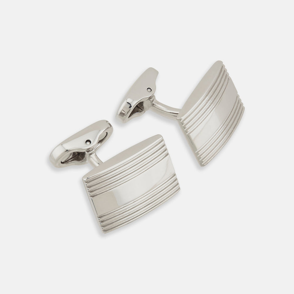 Turnbull & Asser Silver Striped Rectangular Cufflinks feature a subtle horizontal engraved line pattern on the front, set against a white background.