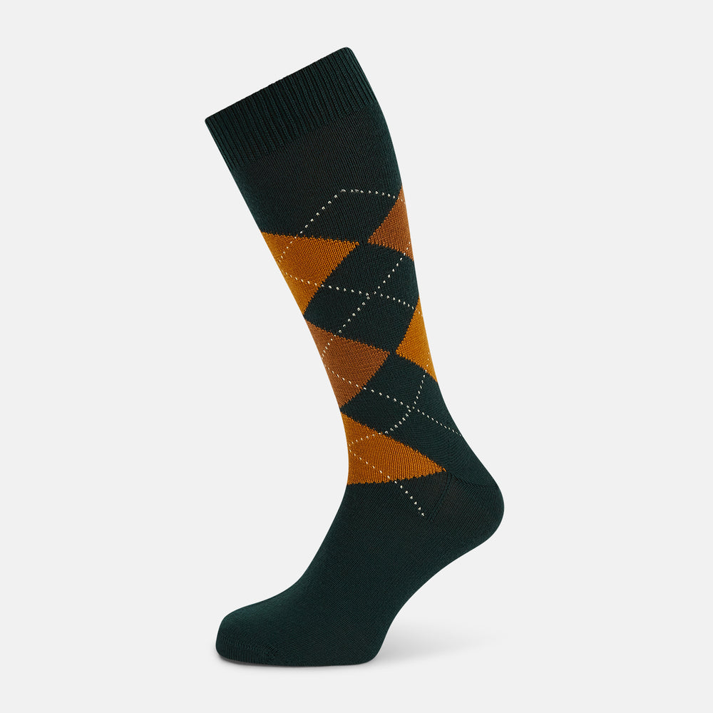 The Forest Green Wool Check Mid-Length Socks by Turnbull & Asser feature a dark green base with orange and brown argyle checks and white dotted lines, shown against a plain white background.