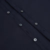 View 7 of product The Navy Westminster Shirt by Turnbull & Asser is a classic long-sleeve, button-up shirt with a pointed collar and buttoned cuffs, exemplifying British craftsmanship, shown against a plain white background.
