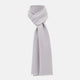 The Turnbull & Asser Ivory and Lilac Lozenge-Patterned Cashmere Knitted Scarf, tied loosely, reveals its refined style and geometric design against a plain white background.