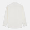 View 3 of product The Turnbull & Asser Cream Silk Tailored Fit Shirt is a long-sleeve button-up with a pointed collar and buttoned cuffs, displayed laid flat against a plain white background.
