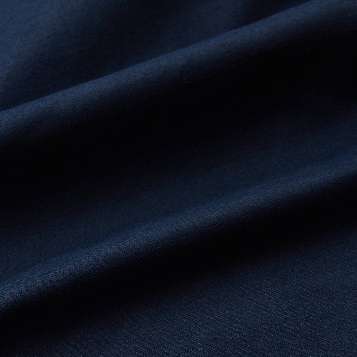 View 4 of product The Turnbull & Asser Navy Cotton Regular Fit Mayfair Shirt is a long-sleeved men’s formal shirt with a collar and white buttons, shown against a plain white background.