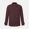 View 1 of product The Burgundy Kingston Corduroy Caban Jacket by Turnbull & Asser features black buttons, a notched collar, and front pockets. Crafted from premium cotton, it is shown on a plain white background.