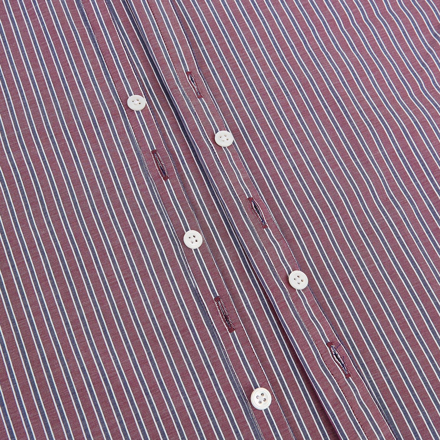 Image 7 of product The Turnbull & Asser Wine Ticking Stripe Westminster Shirt features red, blue, and white vertical pinstripes on white and is shown laid flat on a white surface.