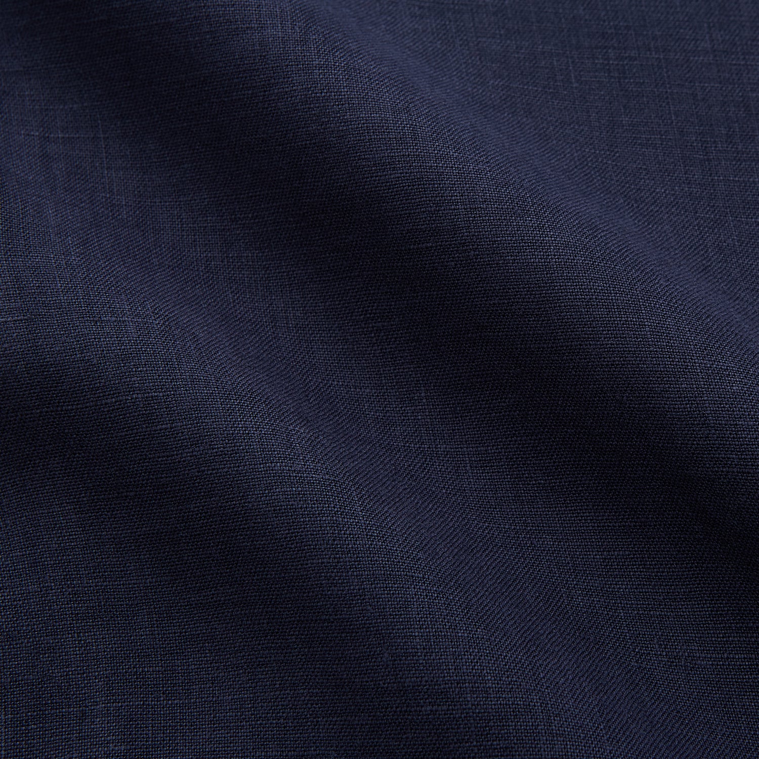 View 4 of product The Turnbull & Asser Navy Hemp Holiday Fit Winnington Shirt is a long-sleeve, button-up shirt with a single chest pocket, shown laid flat on a white background.