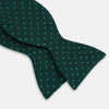 View 3 of product The Turnbull & Asser Dark Green and Navy Micro Dot Silk Bow Tie, featuring a refined dotted pattern, is showcased on a plain white background—an elegant accessory perfect for any occasion.