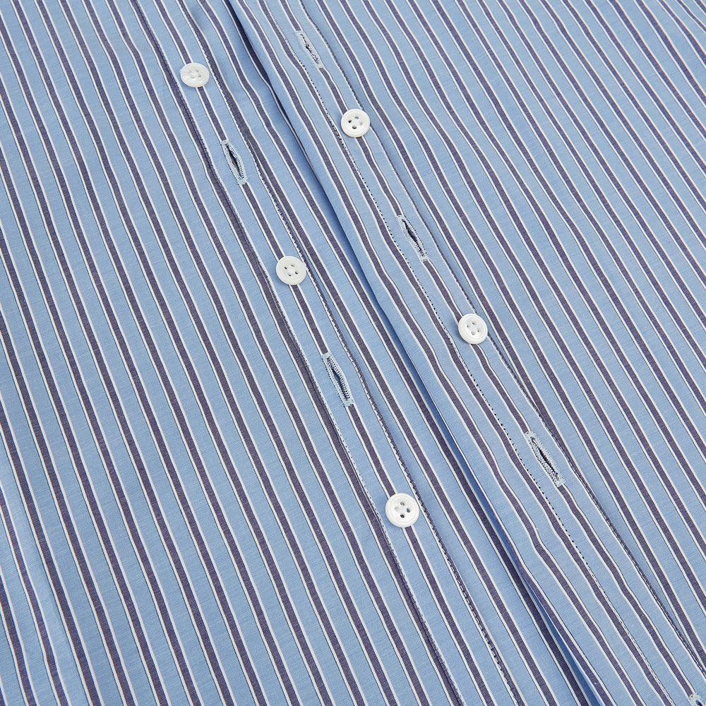 The Steel Blue Ticking Stripe Westminster Shirt by Turnbull & Asser features a classic fit, Turnbull collar, vertical stripes, white buttons, and buttoned cuffs—showcasing refined British craftsmanship.