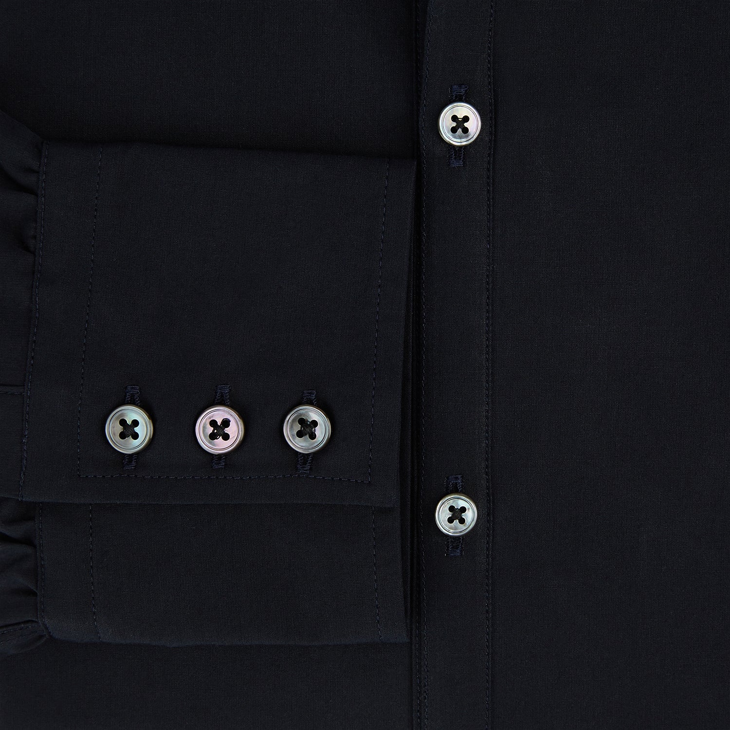 View 4 of product The DARK NAVY WINDSOR SHIRT by Turnbull & Asser is a long-sleeve shirt with a refined Windsor collar, showcasing classic British craftsmanship.