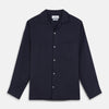 View 2 of product A close-up of Turnbull & Asser's Plain Navy Hemp Cotton Fabric displays its subtle texture within a circular gray-bordered frame on a white background.