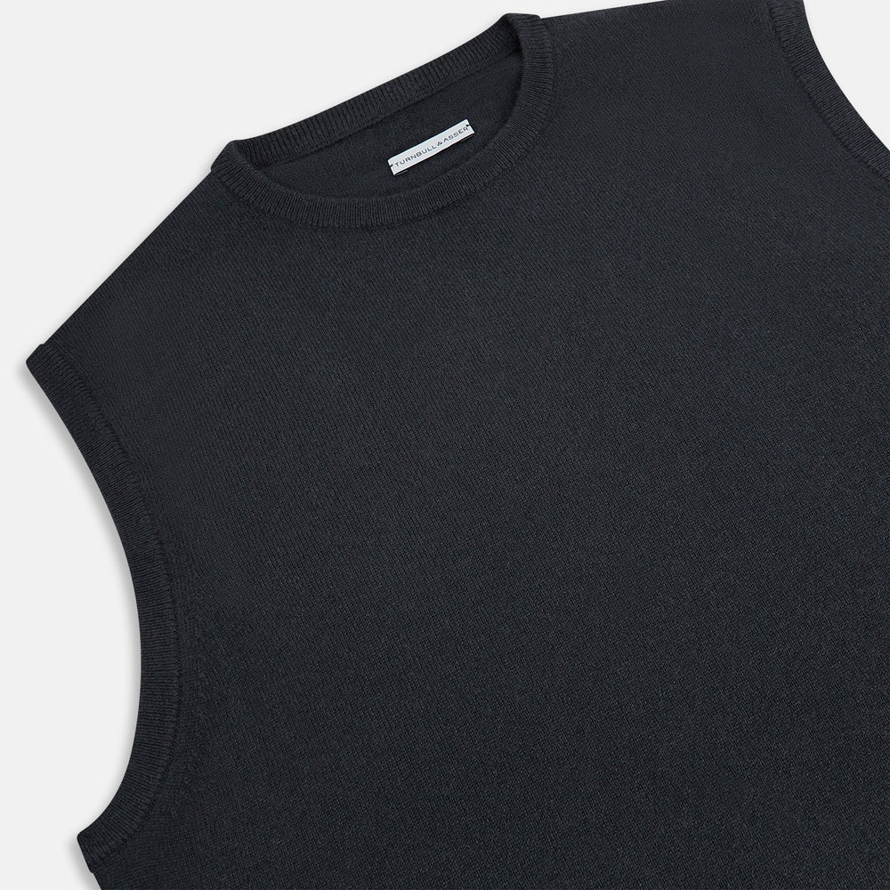 The Turnbull & Asser Dark Green Cashmere Round Neck Vest is a sleeveless knit style with a ribbed hem, shown against a white background—a modern, versatile twist on the classic vest.
