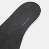 View 3 of product The image shows a single Turnbull & Asser Dark Steel/Navy Polka Dot Mid-Length Sock standing upright on a plain white background, featuring a ribbed cuff and a smooth, seamless finish.