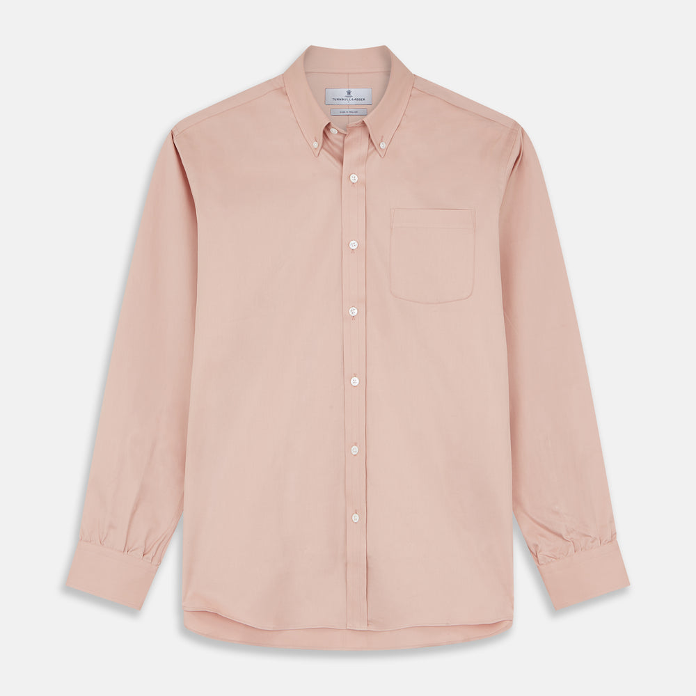 Close-up of Turnbull & Asser’s Plain Pink Piece Dyed Cotton Fabric inside a circular frame, highlighting its fine texture, smooth finish, and soft light reflection.