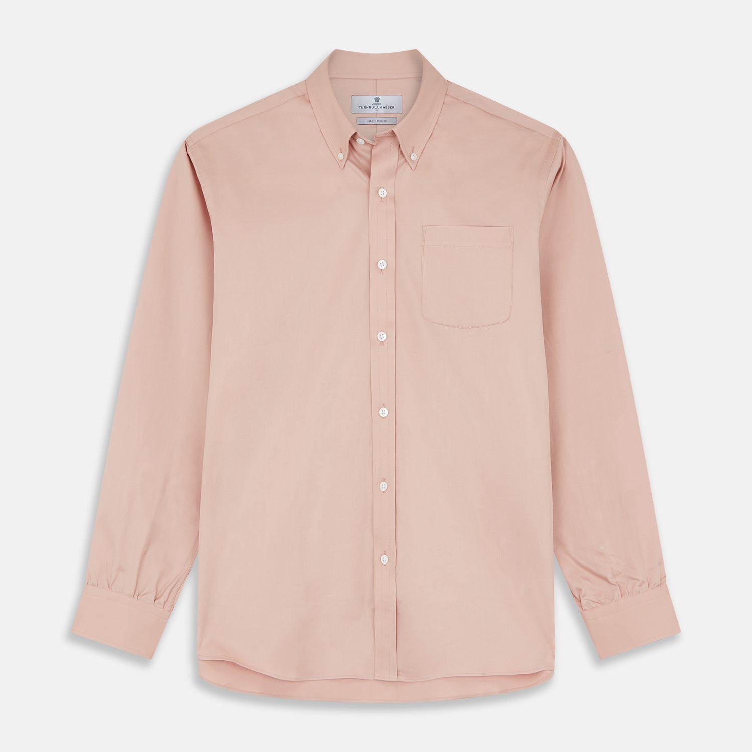 View 2 of product Close-up of Turnbull & Asser’s Plain Pink Piece Dyed Cotton Fabric inside a circular frame, highlighting its fine texture, smooth finish, and soft light reflection.
