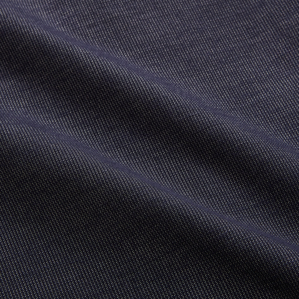 The Turnbull & Asser Navy Hampstead Overshirt features a collar, left chest pocket, two zippered pockets near the bottom, and a classic long-sleeve button-up design, shown laid flat on a white background.