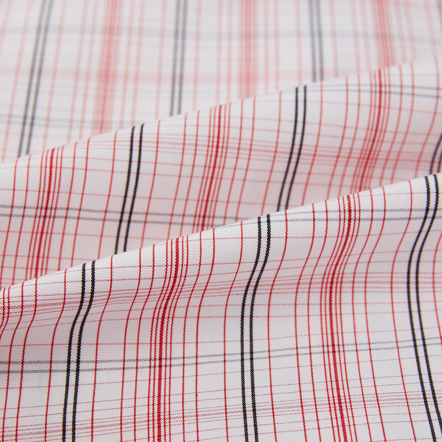 View 6 of product The Turnbull & Asser Red Multi Check Mayfair Shirt is a long-sleeve, button-up with a collar, crafted from Italian cotton and featuring a red multi check plaid pattern on white, shown laid flat against a white surface.