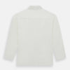 View 5 of product The Turnbull & Asser Cream Silk Pyjama Set, shown laid flat on a white background, features a long-sleeve button-up top with a chest pocket and matching pants with an elastic drawstring waist—ideal for comfortable loungewear.
