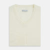 View 10 of product The Turnbull & Asser Cream Fine Merino V-Neck Jumper features long sleeves and classic styling, displayed against a white background.