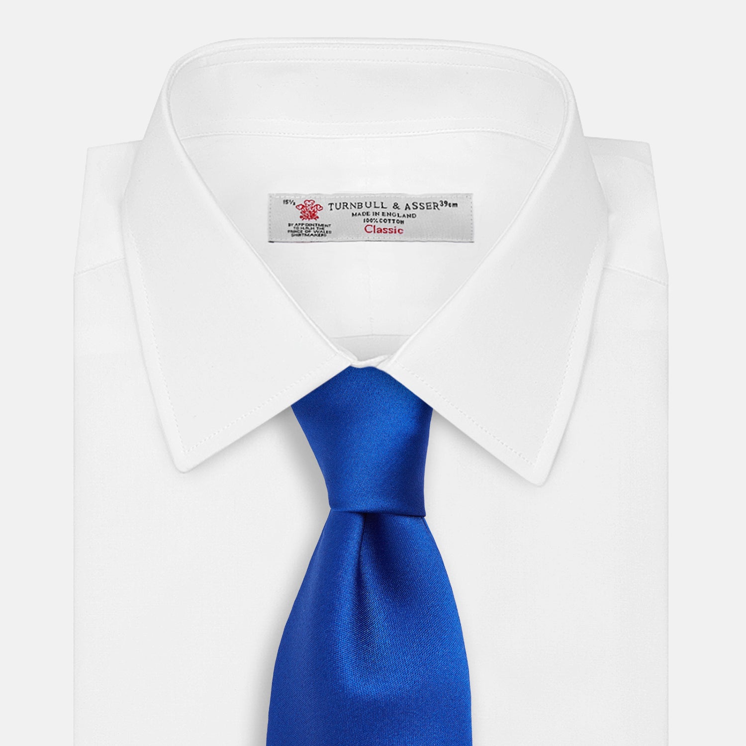 View 2 of product The Turnbull & Asser SATIN CRUISE TIE, in vibrant royal blue with a smooth, lustrous finish, creates a striking contrast against a plain white background.
