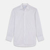 View 2 of product A close-up of Turnbull & Asser’s Purple Multi-stripe Cotton Fabric shows white fabric with thin blue, purple, and yellow vertical stripes in a circular frame on a light gray background.