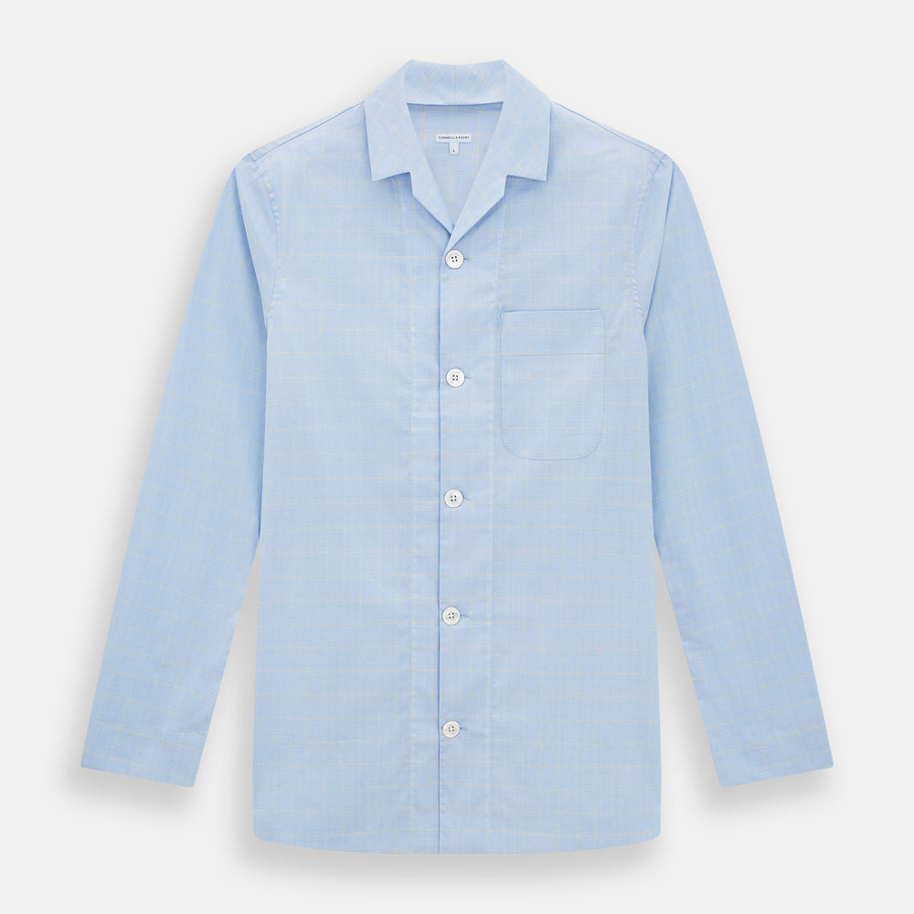 The Turnbull & Asser Blue Prince of Wales Check Pyjama Shirt features long sleeves, a notched collar, a left chest pocket, and a subtle check pattern, shown laid flat on a white background.