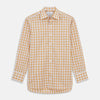 View 2 of product Close-up of Turnbull & Asser’s Orange Multi Check Cotton Fabric, featuring a yellow and white plaid with black and gray lines. Shown within a circular frame on light gray, the material looks soft with slight wrinkles.