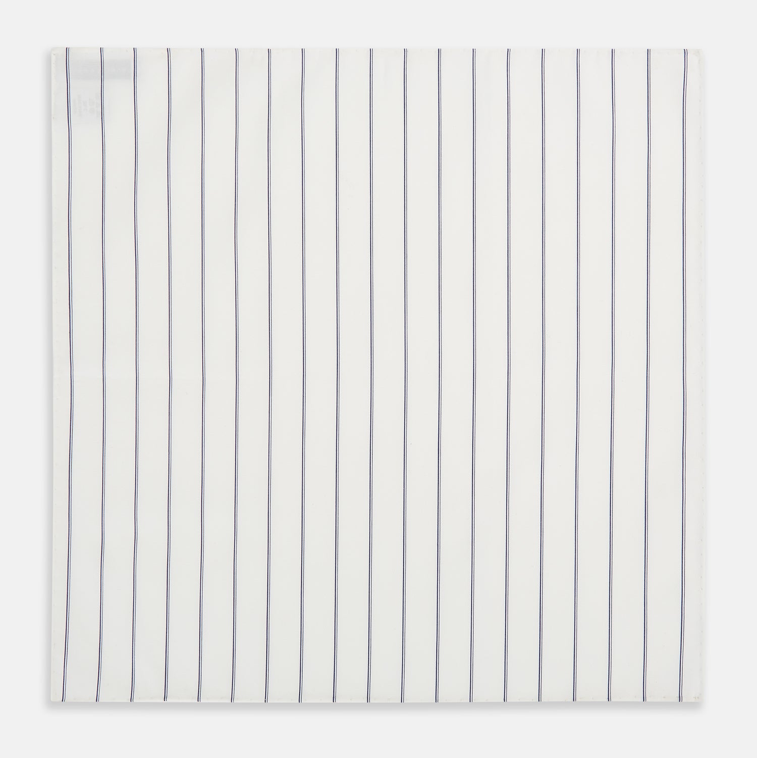 Image 3 of product The Dark Navy Double-Pinstripe Hand-Rolled Handkerchief by Turnbull & Asser features white fabric with evenly spaced thin dark navy stripes and refined hand-rolled edges.