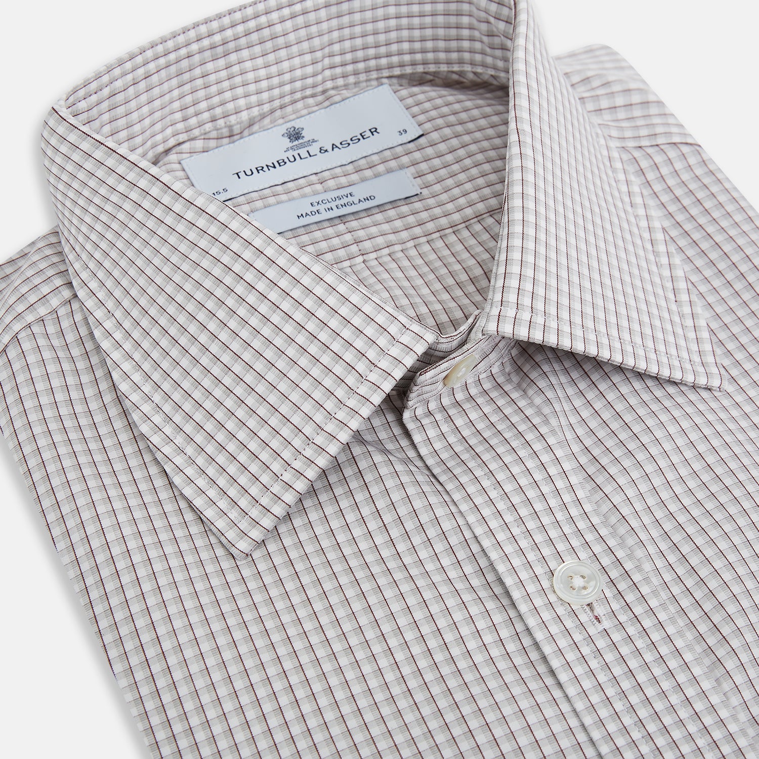 View 2 of product The Turnbull & Asser Grey Micro Shadow Check Mayfair Shirt is crafted from premium Italian cotton with long sleeves, a collar, and buttoned cuffs, shown folded flat against a white background.