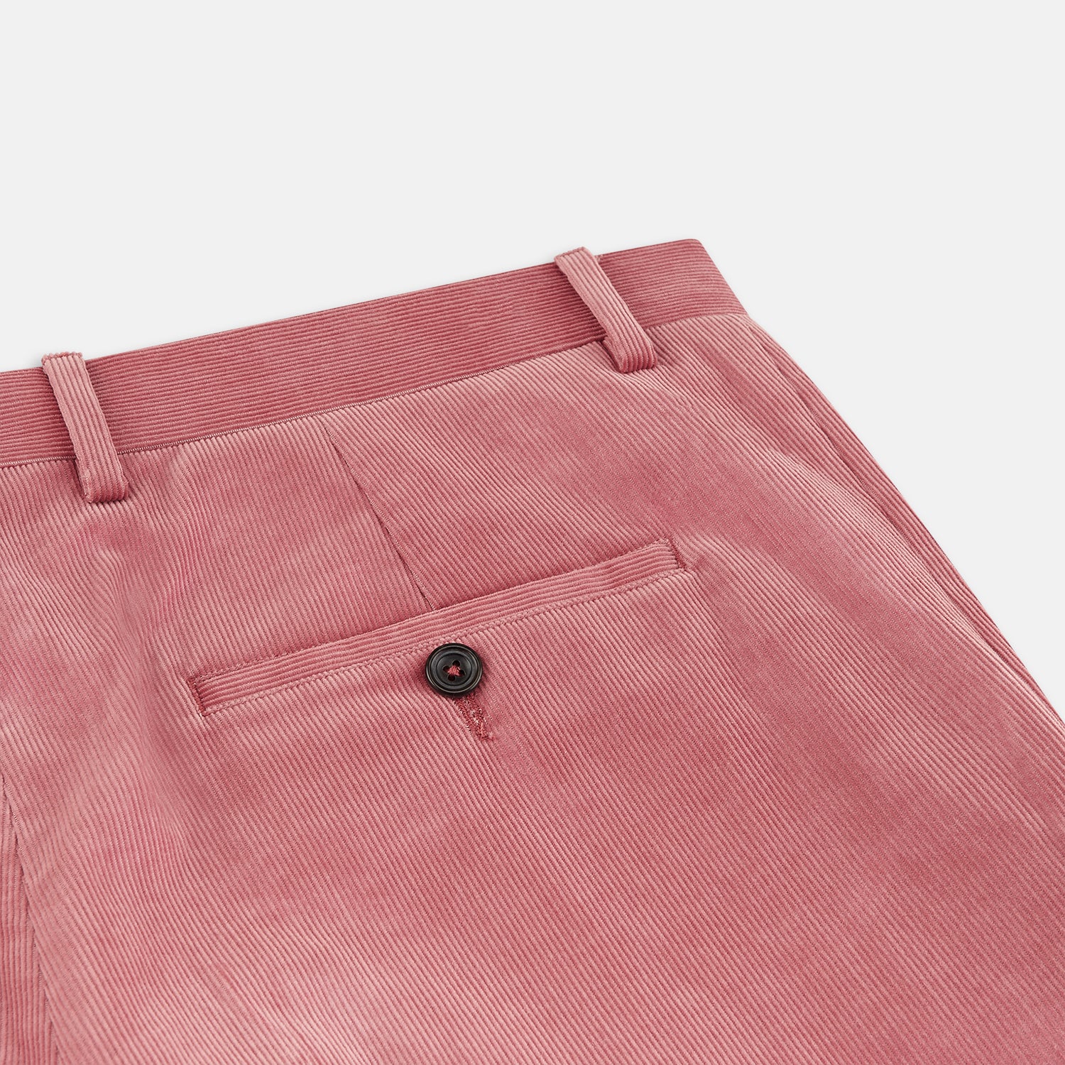 View 2 of product The Pink Cord Manson Trouser by Turnbull & Asser features a modern classic cut in dusty pink with straight legs, side pockets, and belt loops, shown against a plain white background.
