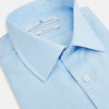 View 2 of product The Pale Blue Rhombus Mayfair Shirt by Turnbull & Asser features long sleeves, a classic collar, white buttons, and buttoned cuffs, shown laid flat on a white background.