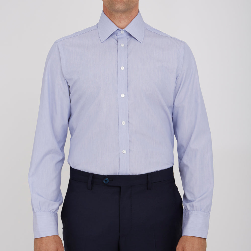 The Turnbull & Asser Blue Hairline Stripe Shirt features a T&A collar, 3-button cuffs, and subtle stripes, displayed neatly folded against a plain white background.