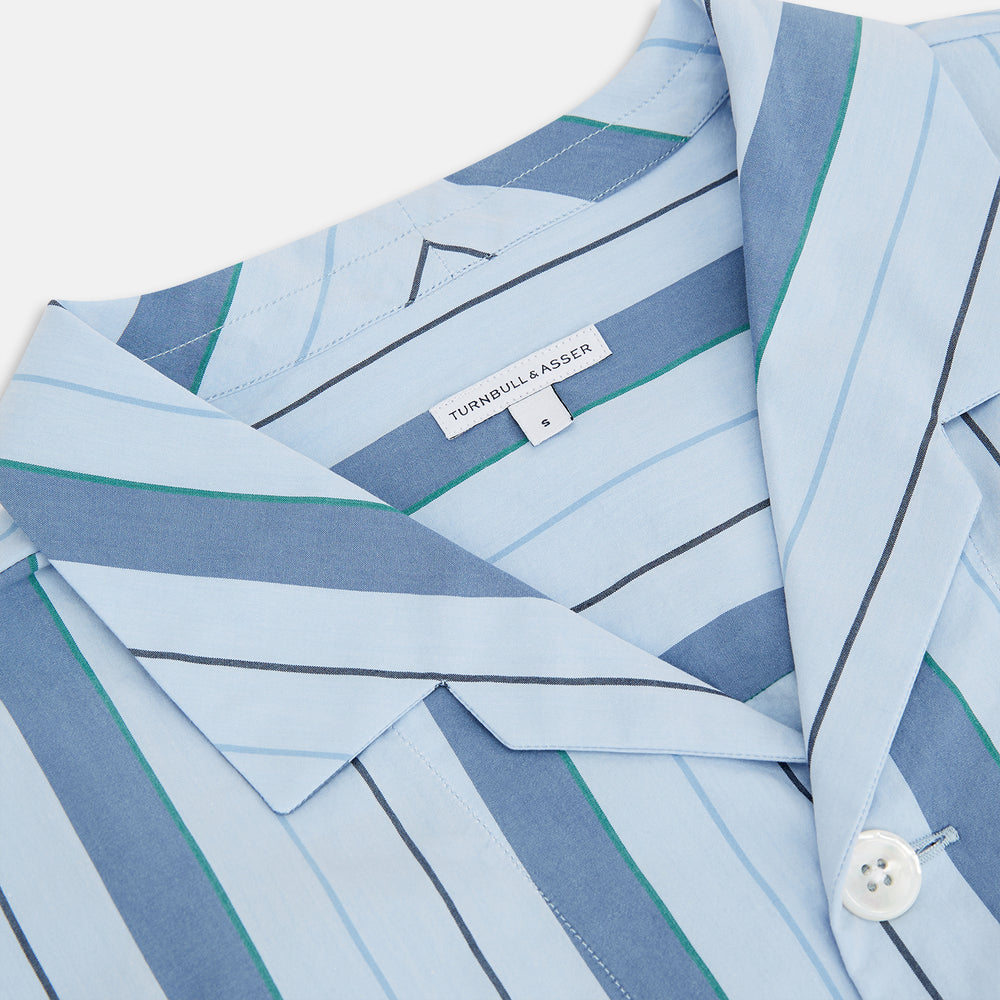The Blue Baiadera Stripe Pyjama Shirt by Turnbull & Asser features long sleeves, a chest pocket, and a notched collar for an elegant nightwear look, shown on a white background.