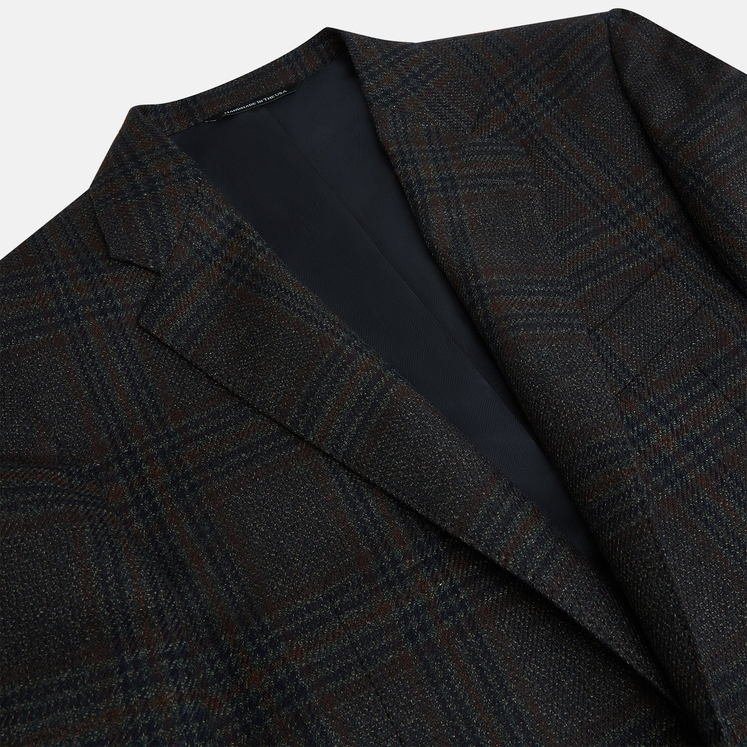 View 2 of product The Turnbull & Asser Charcoal Glen Check Sports Jacket features a dark plaid pattern, single-button closure, notched lapels, and two front flap pockets, shown against a plain white background—an essential for any men's wardrobe.