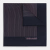 View 1 of product The Navy and Pink Stripe Silk Pocket Square by Turnbull & Asser features thin pink stripes, a geometric border, hand-rolled edges, and "TURNBULL & ASSER HAND PRINTED IN ENGLAND" printed in white.
