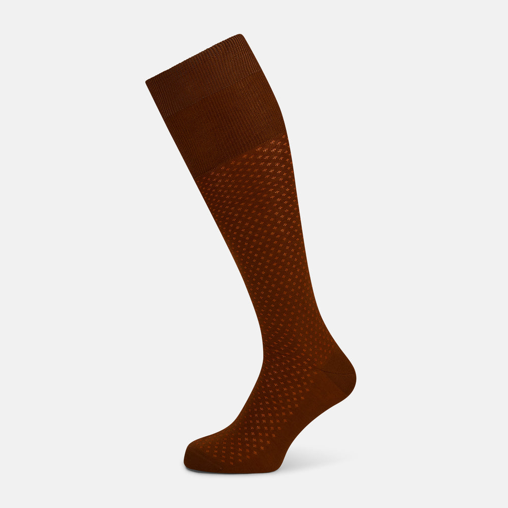 The Rust Motif Long Sock by Turnbull & Asser, featuring a subtle diamond pattern and crafted from mercerised Egyptian cotton, is shown individually against a plain white background.