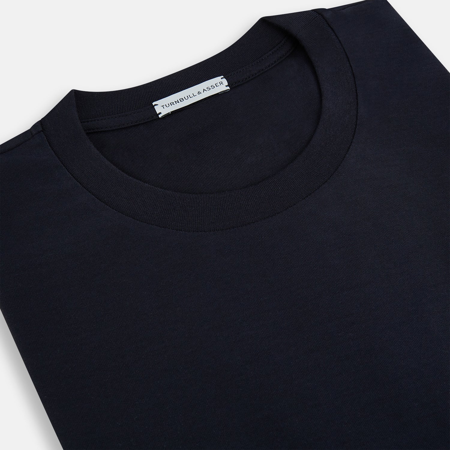 View 2 of product A versatile, high-quality navy short-sleeve t-shirt by Turnbull & Asser, featuring a classic crew neckline, laid flat on a white background.