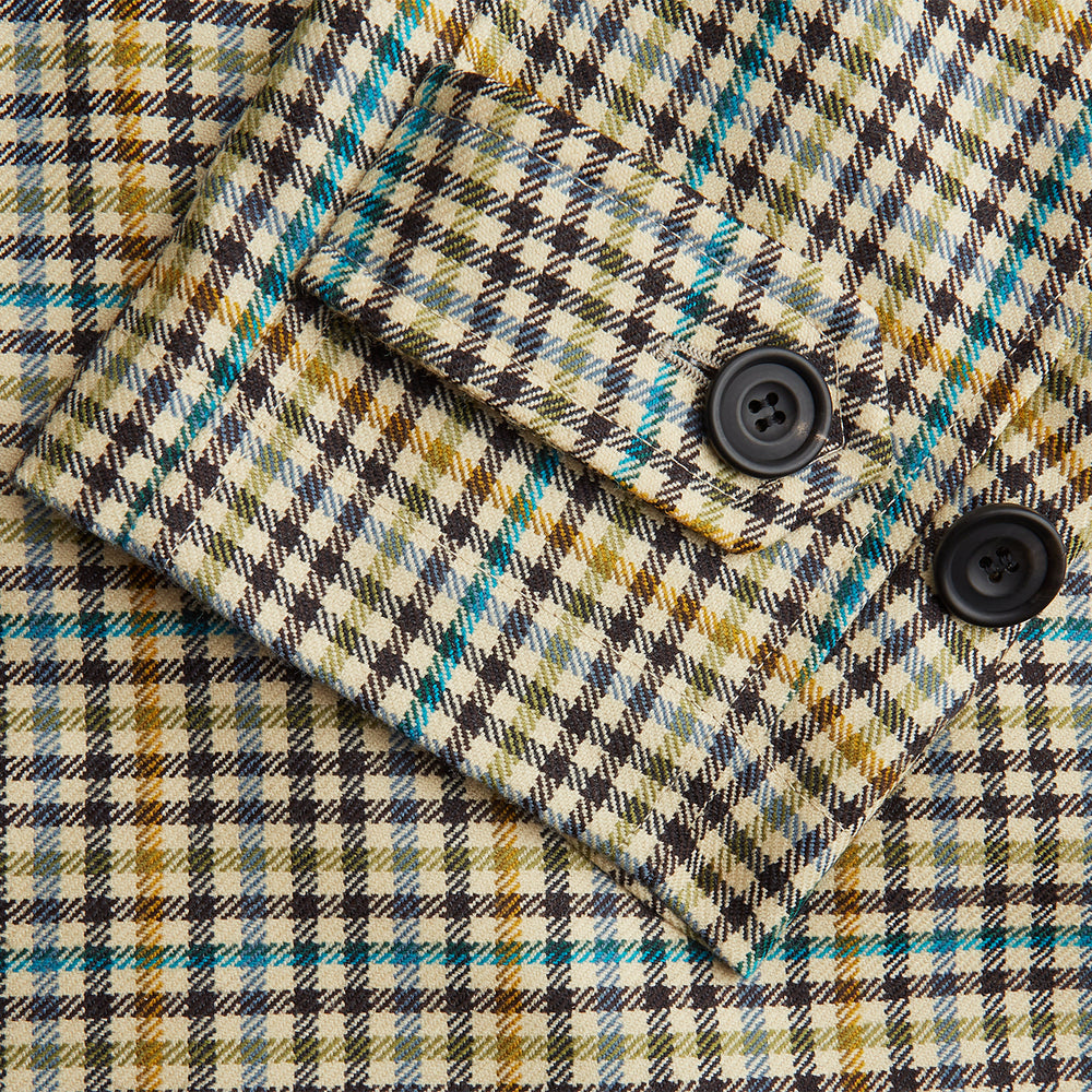 The Turnbull & Asser Green and Blue Multi Check Wool Elliot Coat is a men’s knee-length, long-sleeved overcoat with a collar and button-up front, crafted from Scottish wool in a check plaid pattern, shown on a white background.