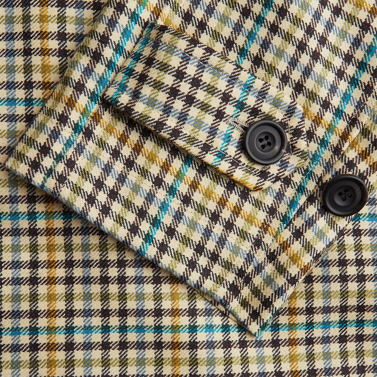 View 3 of product The Turnbull & Asser Green and Blue Multi Check Wool Elliot Coat is a men’s knee-length, long-sleeved overcoat with a collar and button-up front, crafted from Scottish wool in a check plaid pattern, shown on a white background.