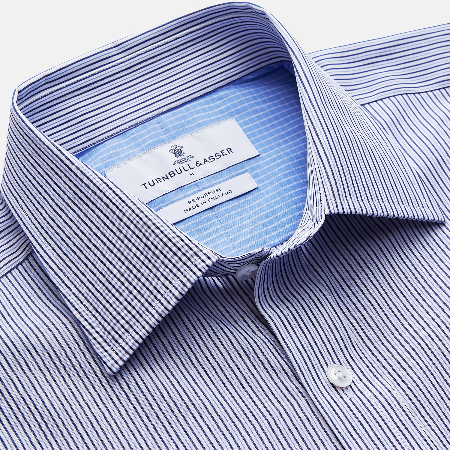 View 3 of product The Turnbull & Asser Blue Multi Stripe Cotton RE-PURPOSE Weekend Fit Finch Shirt features thin blue and white stripes, a contrasting light blue checkered chest pocket, and is crafted sustainably using recycled fabrics.