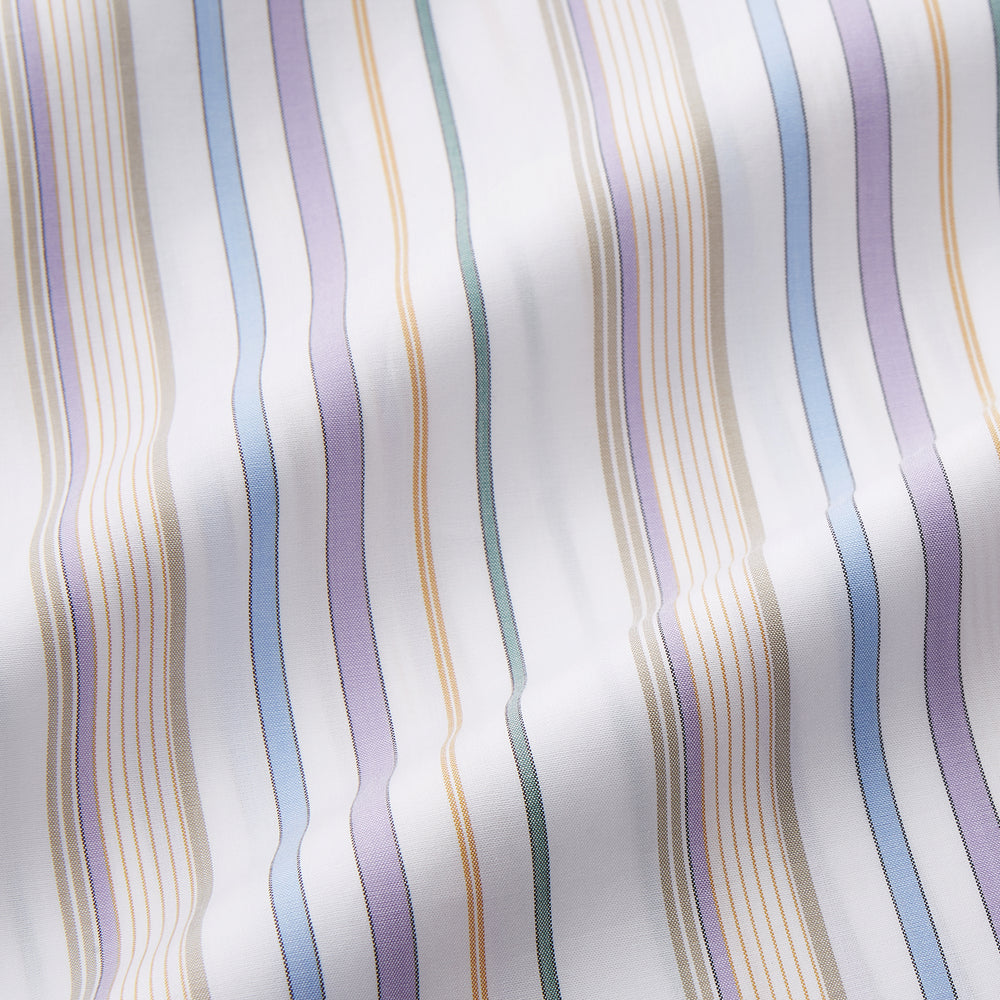 The Turnbull & Asser Colourful Garden Multi Stripe Cotton Sussex Nightshirt is UK-made, featuring vibrant stripes on white for timeless style and luxurious sleepwear comfort.