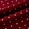 View 3 of product The Burgundy and White Spotted Silk Scarf by Turnbull & Asser features a gradient of white polka dots, short fringed edges, and the brand's name near the ends—a timeless classic foulard.