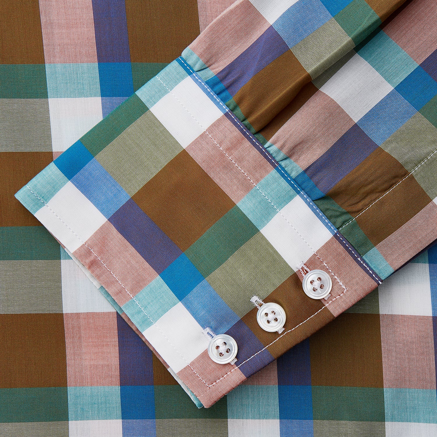 View 4 of product The Turnbull & Asser Green and Pink Multi-check Cotton Blend Regular Fit Mayfair Shirt features a classic T&A collar, white buttons, and an olive green, blue, white, and pink plaid pattern.