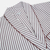 View 2 of product The Burgundy Multi Stripe Winston Gown by Turnbull & Asser features long sleeves, a shawl collar, waist belt, three pockets, and red piping accents for a classic Churchill-inspired touch.