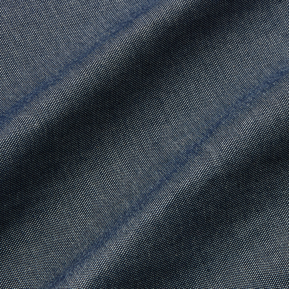 The Turnbull & Asser Plain Blue Oxford Cotton Weekend Fit Blake Shirt features long sleeves, a stand collar, and white buttons, displayed flat on a white background.