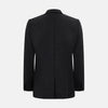 View 3 of product The Turnbull & Asser Charcoal Knitted Oxford Blazer features a notched lapel, two-button closure, and three front pockets, blending modern elegance with British heritage against a plain white background.
