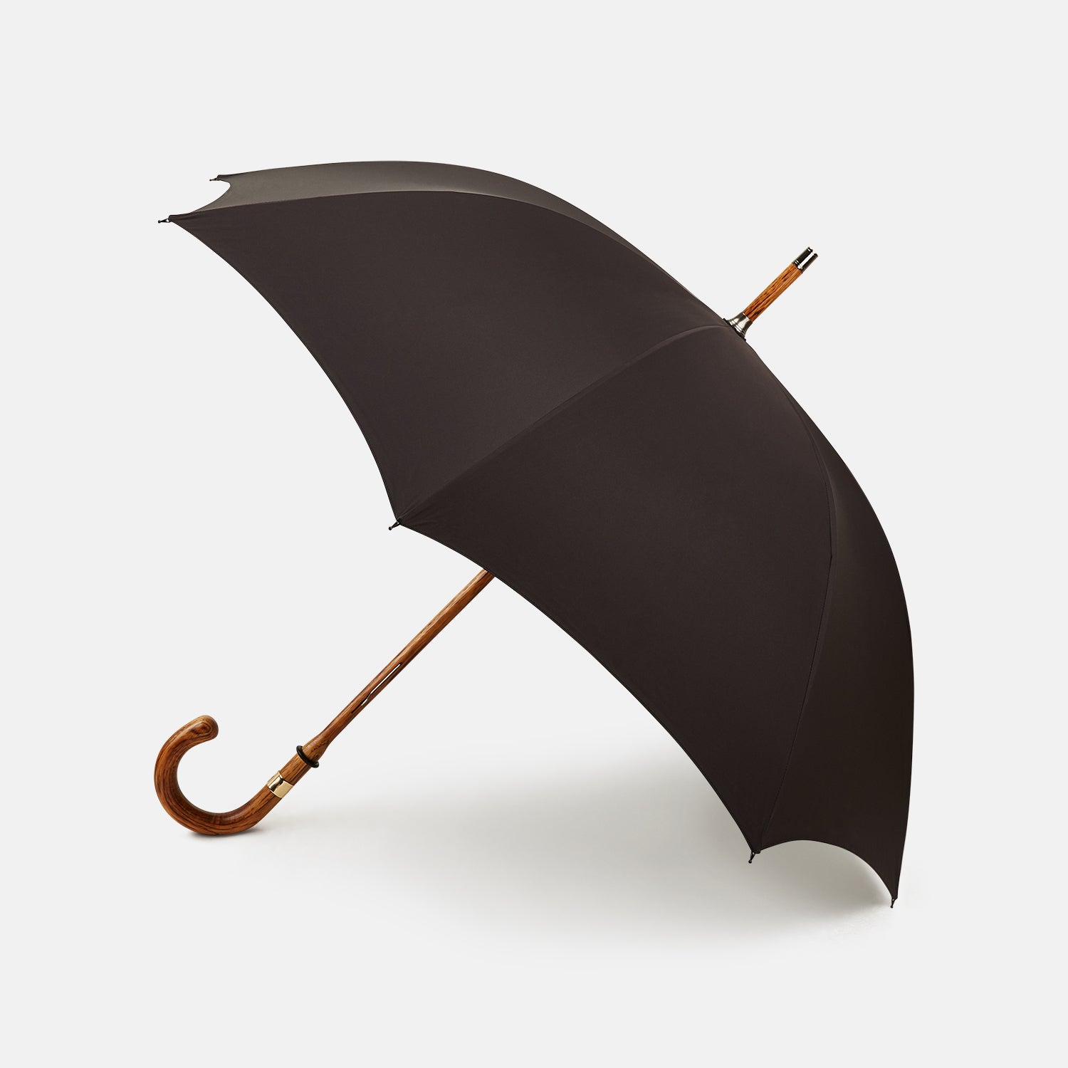 View 1 of product A Black Telescopic Umbrella by Turnbull & Asser with a curved maple handle and shaft, open and angled against a plain white background.