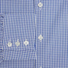 View 4 of product The Turnbull & Asser Blue Grid Check Belgravia Shirt, made from pure cotton with long sleeves, a spread collar, buttoned cuffs, and a blue-and-white check pattern, is laid flat on a white background.
