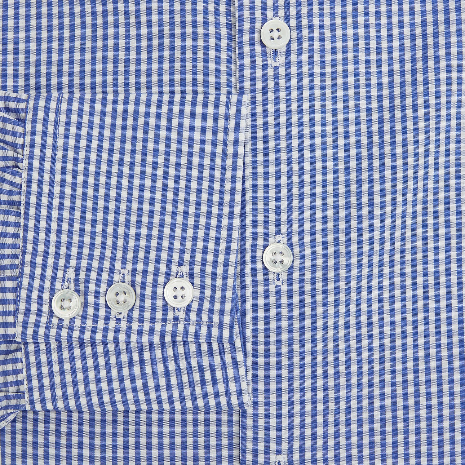View 4 of product The Turnbull & Asser Blue Grid Check Belgravia Shirt, made from pure cotton with long sleeves, a spread collar, buttoned cuffs, and a blue-and-white check pattern, is laid flat on a white background.