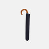 View 2 of product The Turnbull & Asser Navy Telescopic Umbrella features a brown maple crook handle and is shown fully open against a plain white background.