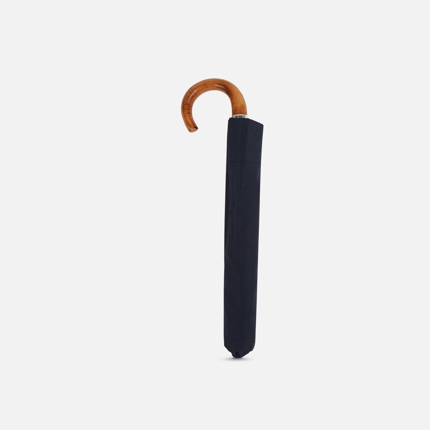 View 2 of product The Turnbull & Asser Navy Telescopic Umbrella features a brown maple crook handle and is shown fully open against a plain white background.